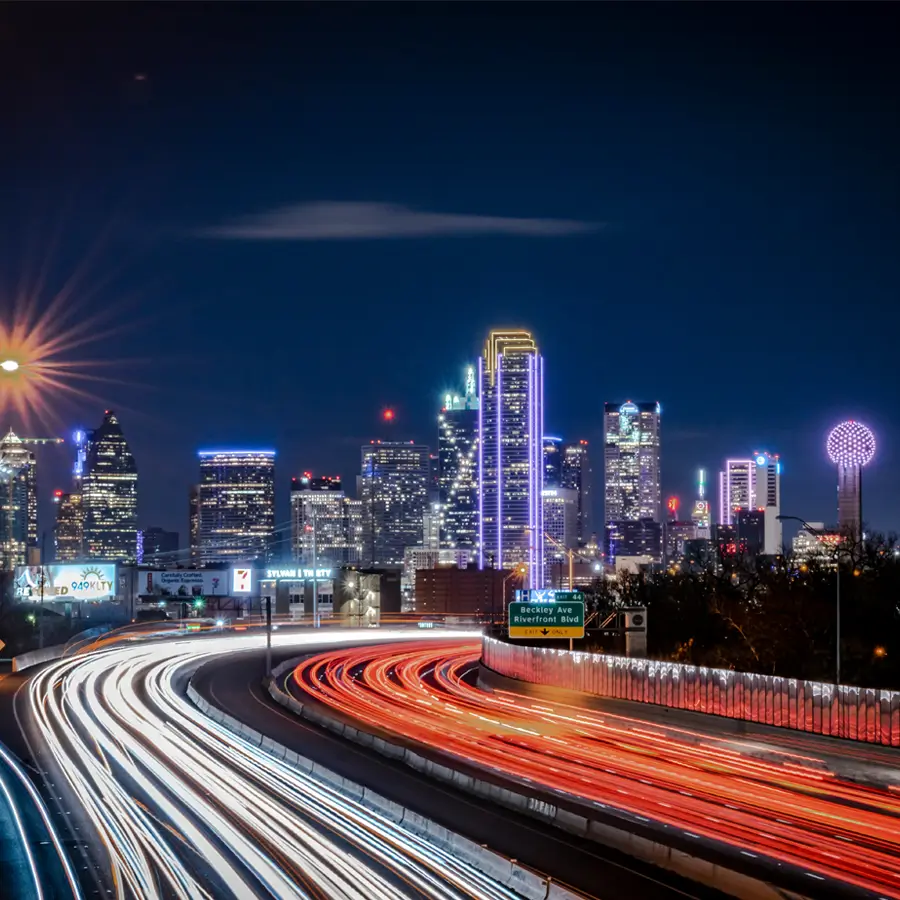 Dallas Texas skyline at night with illuminated skyscrapers and city lights