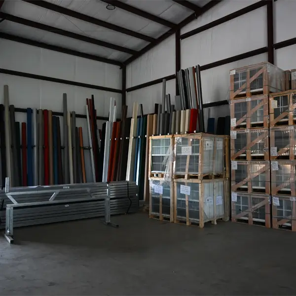 Trim pieces in different colors and windows packed in shipping crates.